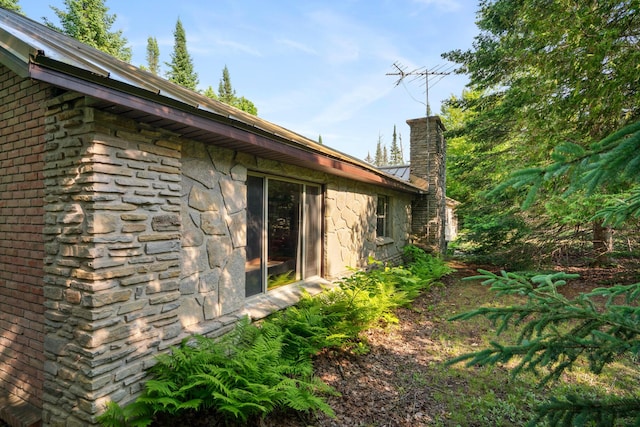 9150 W M-68, Indian River, MI 49749 - view of home's exterior with stone siding