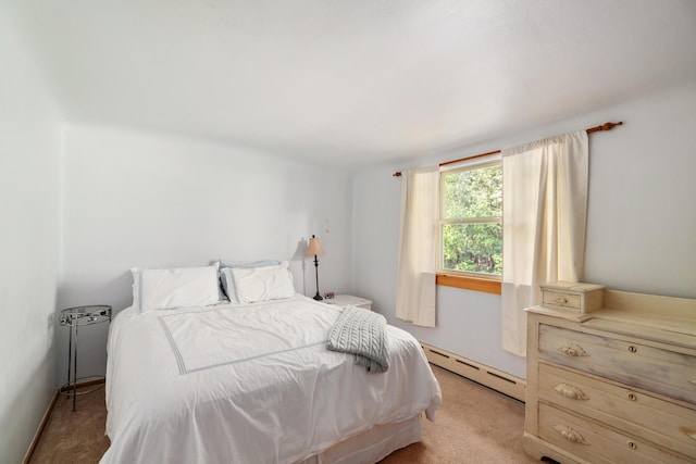 9150 W M-68, Indian River, MI 49749 - bedroom featuring a baseboard heating unit and light carpet