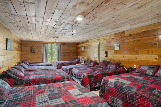 3221 Krause Rd, Petoskey, MI 49770 - bedroom featuring wooden walls and carpet flooring
