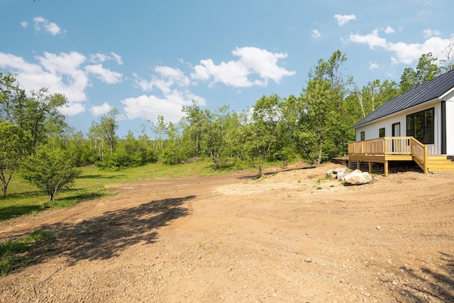 8428 Dusty Trl, Gaylord, MI 49735 - view of yard featuring a deck