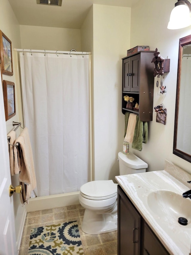 166 Long Rapids Rd, Alpena, MI 49707 - full bath featuring vanity, toilet, baseboards, and a shower with curtain