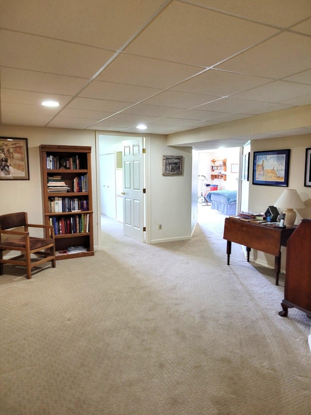 166 Long Rapids Rd, Alpena, MI 49707 - living area with carpet floors and a paneled ceiling