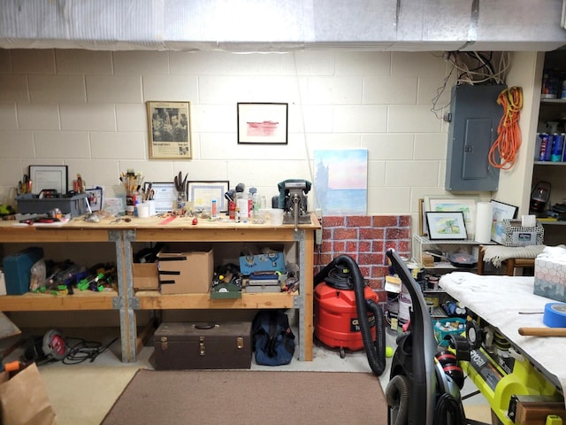 166 Long Rapids Rd, Alpena, MI 49707 - office with electric panel, a workshop area, concrete flooring, and concrete block wall