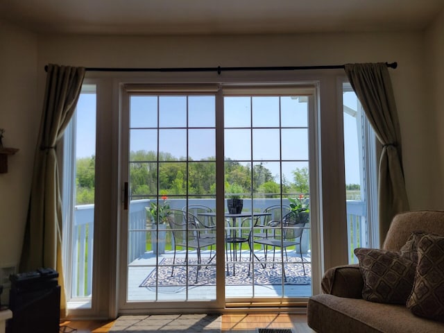 166 Long Rapids Rd, Alpena, MI 49707 - doorway featuring wood finished floors