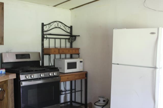 1864 Lenroy Valley Rd, Luzerne, MI 48636 - kitchen featuring white appliances