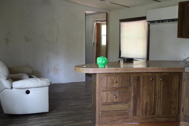 1864 Lenroy Valley Rd, Luzerne, MI 48636 - office space with an AC wall unit and dark wood finished floors