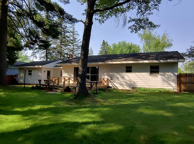 206 N Sixth St, Roscommon, MI 48653 - back of property featuring a deck