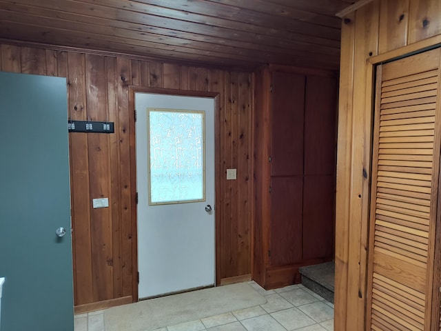 206 N Sixth St, Roscommon, MI 48653 - foyer featuring wood ceiling, light tile patterned flooring, and wood walls