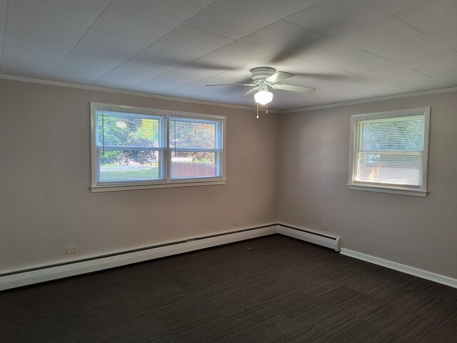 206 N Sixth St, Roscommon, MI 48653 - unfurnished room featuring plenty of natural light, a ceiling fan, ornamental molding, dark colored carpet, and baseboards