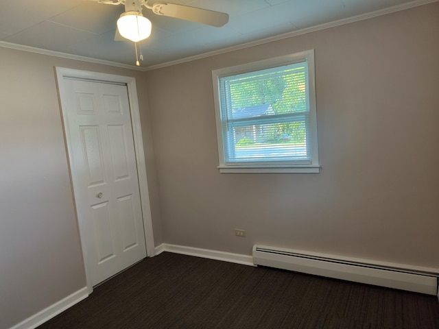 206 N Sixth St, Roscommon, MI 48653 - unfurnished room featuring baseboard heating, baseboards, ornamental molding, ceiling fan, and dark carpet