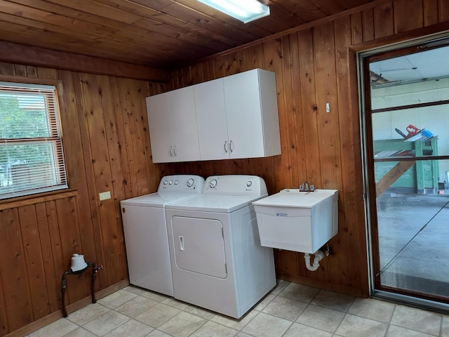 206 N Sixth St, Roscommon, MI 48653 - laundry room with independent washer and dryer, wood walls, cabinet space, wooden ceiling, and light tile patterned floors