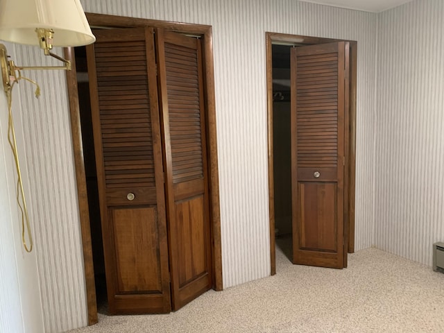 14501 3rd St, Hubbard Lake, MI 49747 - unfurnished bedroom with carpet flooring and wallpapered walls