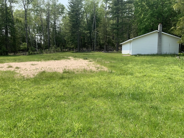 14501 3rd St, Hubbard Lake, MI 49747 - view of yard with a view of trees