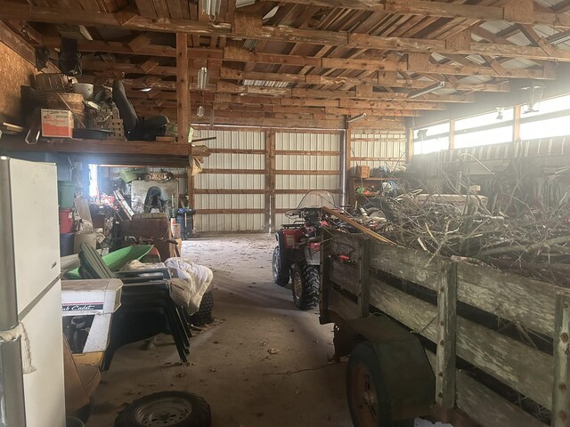 8091 Truax Rd, Hillman, MI 49746 - garage with freestanding refrigerator