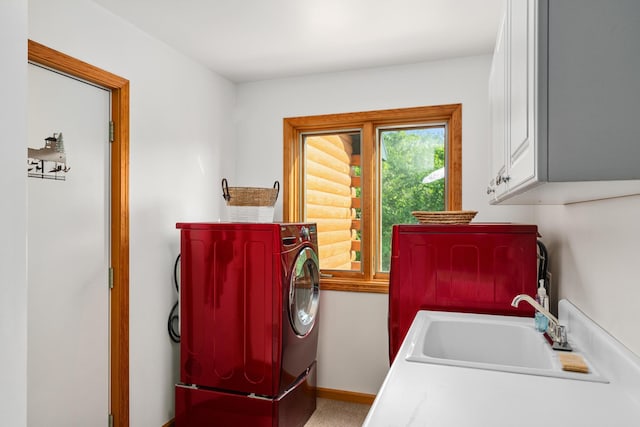 10077 Royal Coachman Trl, Gaylord, MI 49735 - laundry area with cabinet space, washer and dryer, and baseboards