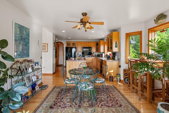 10077 Royal Coachman Trl, Gaylord, MI 49735 - dining area featuring light wood-type flooring, a ceiling fan, recessed lighting, and baseboards