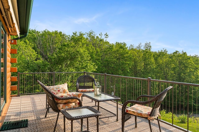 10077 Royal Coachman Trl, Gaylord, MI 49735 - balcony with a forest view