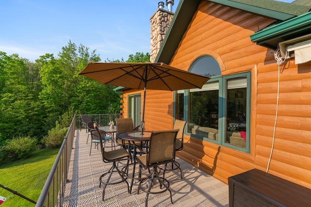10077 Royal Coachman Trl, Gaylord, MI 49735 - wooden deck with outdoor dining space