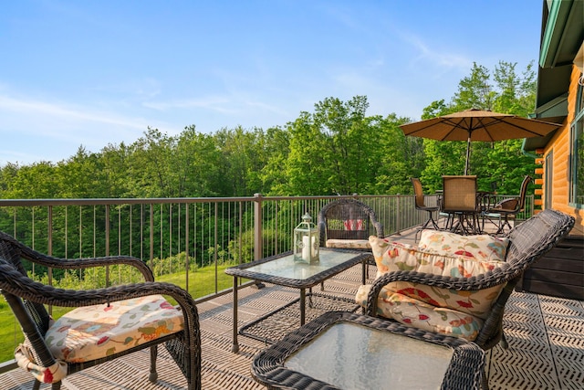 10077 Royal Coachman Trl, Gaylord, MI 49735 - balcony with outdoor dining space