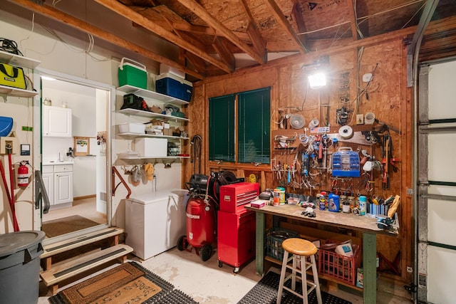 10077 Royal Coachman Trl, Gaylord, MI 49735 - garage featuring a workshop area
