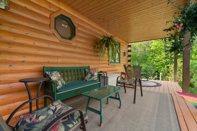 10077 Royal Coachman Trl, Gaylord, MI 49735 - wooden terrace with an outdoor living space