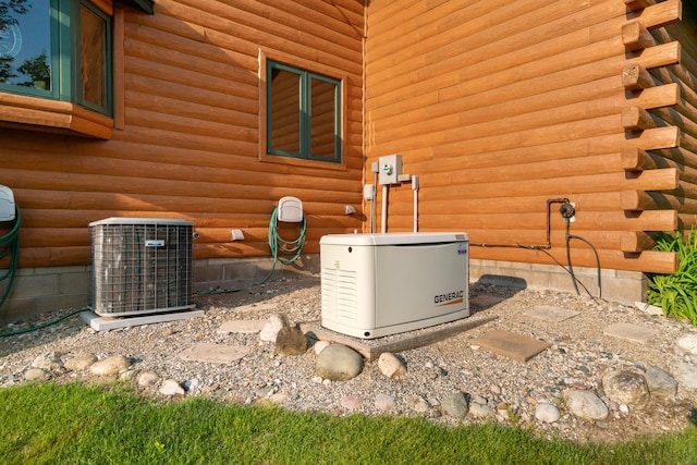 10077 Royal Coachman Trl, Gaylord, MI 49735 - exterior view of a power unit and central AC unit