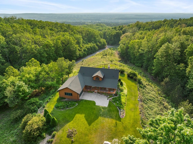 10077 Royal Coachman Trl, Gaylord, MI 49735 - aerial view of property and surrounding area featuring a heavily wooded area