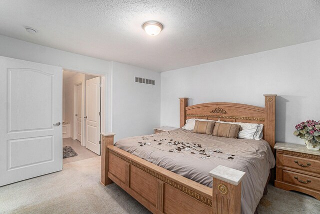 10480 N Straits Hwy, Cheboygan, MI 49721 - bedroom with light colored carpet and a textured ceiling