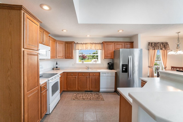 10480 N Straits Hwy, Cheboygan, MI 49721 - kitchen featuring white appliances, a sink, recessed lighting, light countertops, and light tile patterned floors