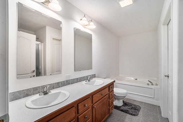10480 N Straits Hwy, Cheboygan, MI 49721 - full bath with double vanity, a garden tub, toilet, a stall shower, and tile patterned flooring