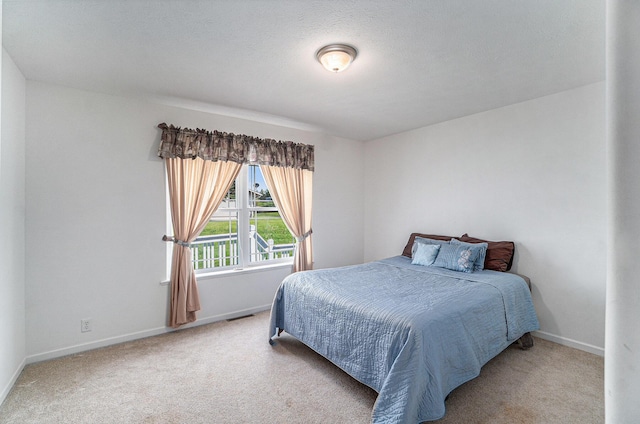 10480 N Straits Hwy, Cheboygan, MI 49721 - carpeted bedroom featuring baseboards