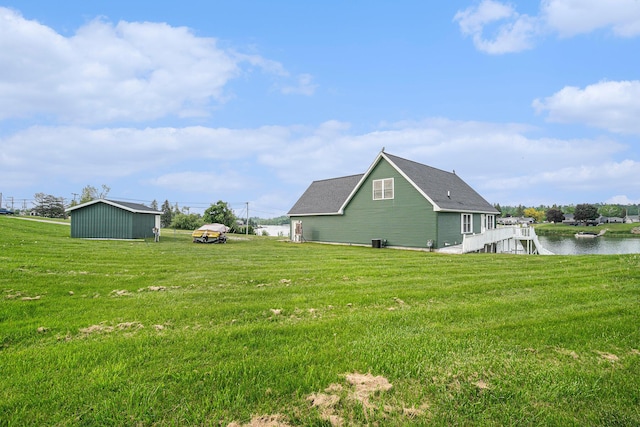 10480 N Straits Hwy, Cheboygan, MI 49721 - view of green lawn featuring a water view