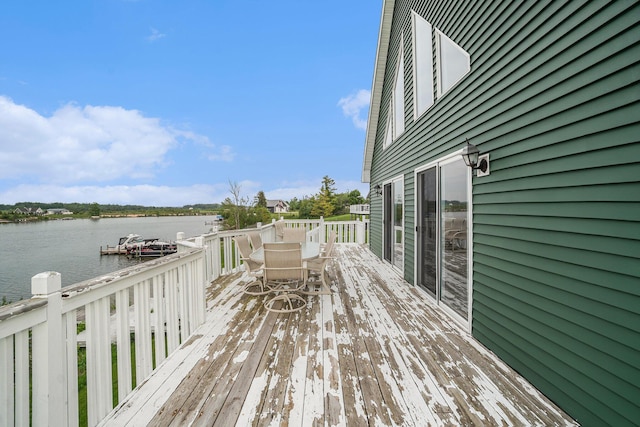 10480 N Straits Hwy, Cheboygan, MI 49721 - wooden terrace featuring a water view and outdoor dining space