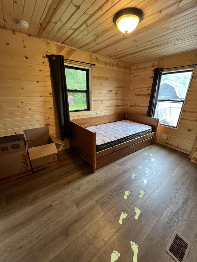118 Westview Dr, Houghton Lake, MI 48629 - bedroom featuring wood ceiling, wood-type flooring, and wood walls