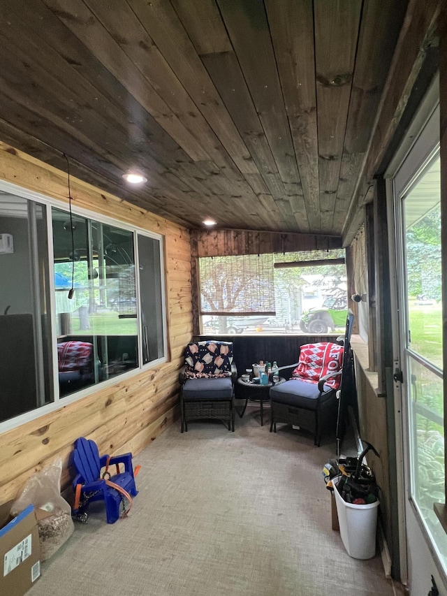 118 Westview Dr, Houghton Lake, MI 48629 - sunroom / solarium with carpet floors, healthy amount of natural light, outdoor lounge area, wooden walls, and wood ceiling