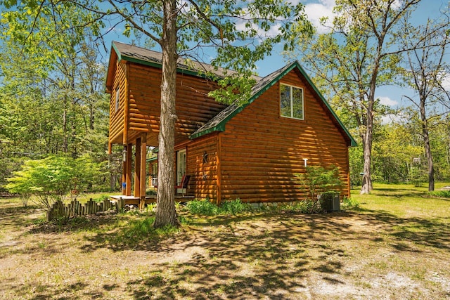 5466 Big Wolf Ln, Lewiston, MI 49756 - view of home's exterior featuring log veneer siding