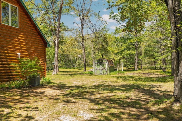 5466 Big Wolf Ln, Lewiston, MI 49756 - view of green lawn featuring a storage unit