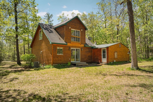 5466 Big Wolf Ln, Lewiston, MI 49756 - back of property with a yard, faux log siding, and a shingled roof