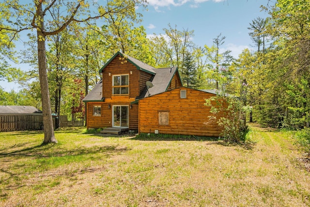 5466 Big Wolf Ln, Lewiston, MI 49756 - back of house with roof with shingles