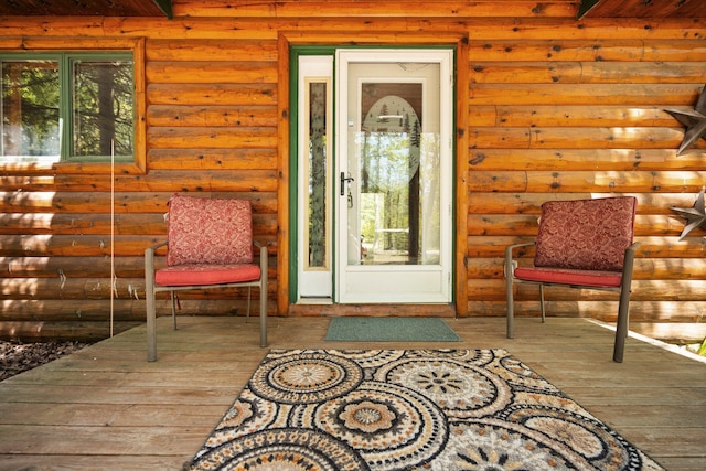 5466 Big Wolf Ln, Lewiston, MI 49756 - view of exterior entry featuring a wooden deck