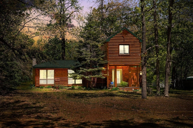 5466 Big Wolf Ln, Lewiston, MI 49756 - view of front of property with a chimney and log veneer siding