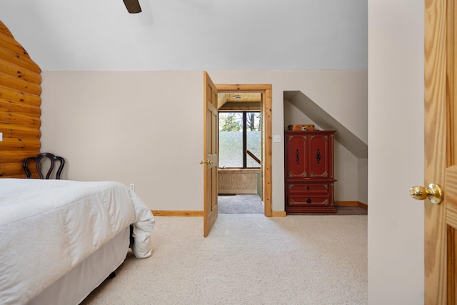 5466 Big Wolf Ln, Lewiston, MI 49756 - bedroom featuring vaulted ceiling, carpet, and ceiling fan