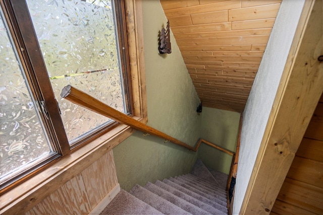 5466 Big Wolf Ln, Lewiston, MI 49756 - staircase with a textured wall, wooden ceiling, and vaulted ceiling