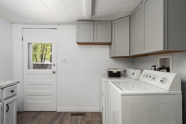 5466 Big Wolf Ln, Lewiston, MI 49756 - washroom with cabinet space, washer and clothes dryer, and dark wood finished floors