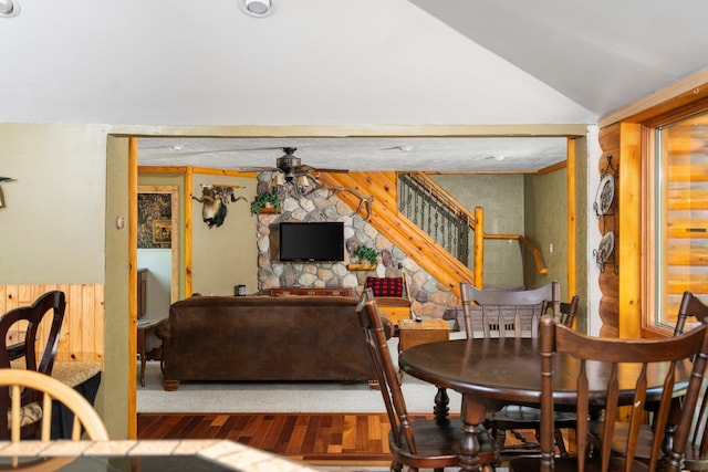 5466 Big Wolf Ln, Lewiston, MI 49756 - dining area featuring lofted ceiling, wood finished floors, and stairway
