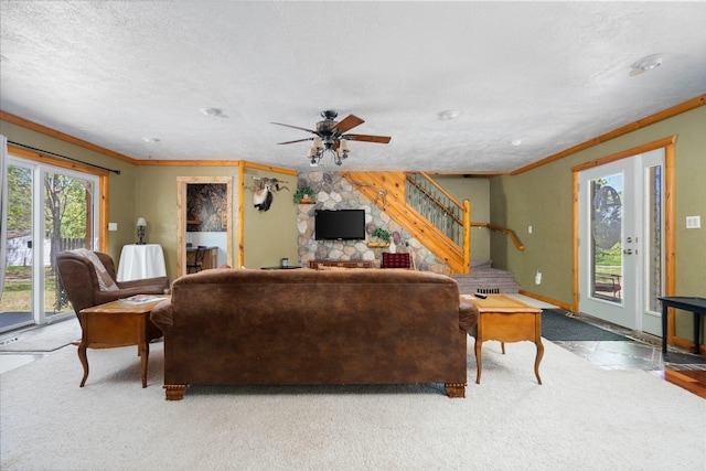 5466 Big Wolf Ln, Lewiston, MI 49756 - living room featuring stairway, ornamental molding, ceiling fan, carpet, and a textured ceiling