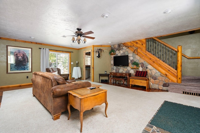 5466 Big Wolf Ln, Lewiston, MI 49756 - carpeted living room featuring a ceiling fan and stairway