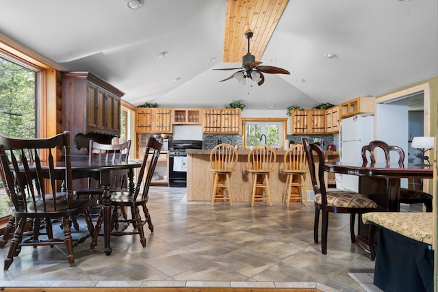 5466 Big Wolf Ln, Lewiston, MI 49756 - dining room with a ceiling fan, lofted ceiling, and recessed lighting