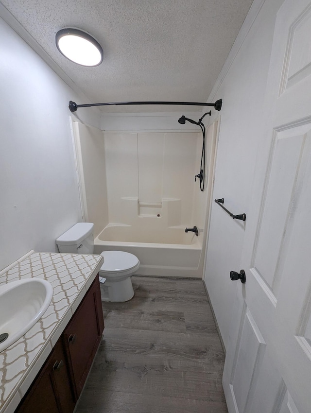 7322 E Grand Lake Rd, Presque Isle, MI 49777 - full bath featuring a textured ceiling, vanity, wood finished floors, and bathtub / shower combination