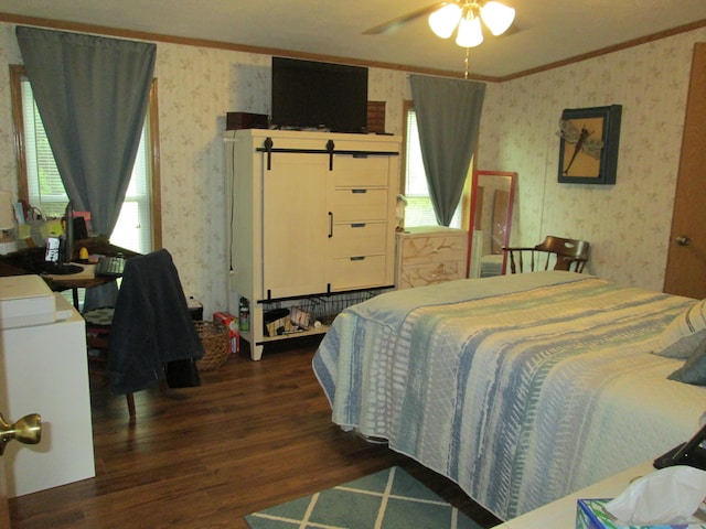 5189 Pinecrest Dr, Lewiston, MI 49756 - bedroom with wallpapered walls, ornamental molding, dark wood-type flooring, and multiple windows